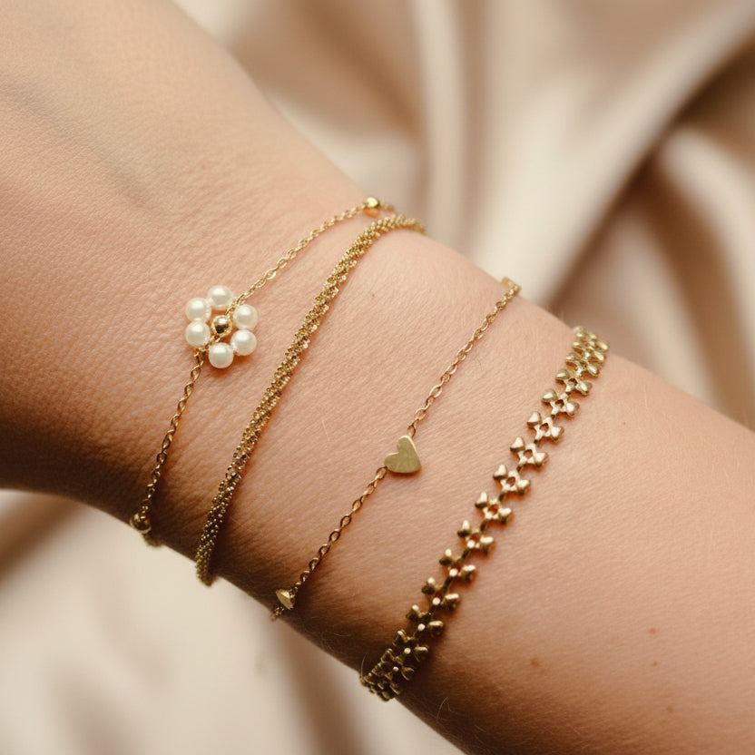 Armband goud schakel hartjes - Sieradenkaart