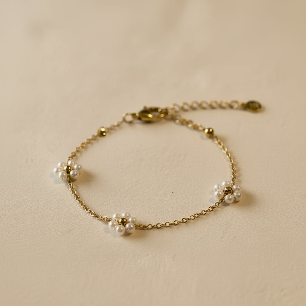 Armband goud madeliefjes parels