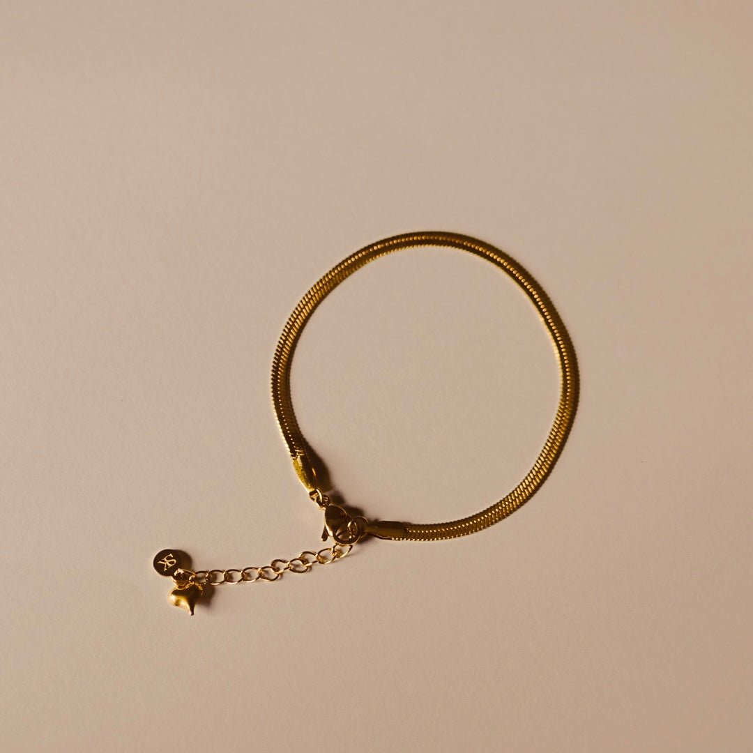 Armband goud schakel plat en hartje - Sieradenkaart